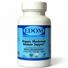 A bottle of EDOM Organic Mushroom Immune Support supplements with a label showing the brand and the mushrooms included in the blend.